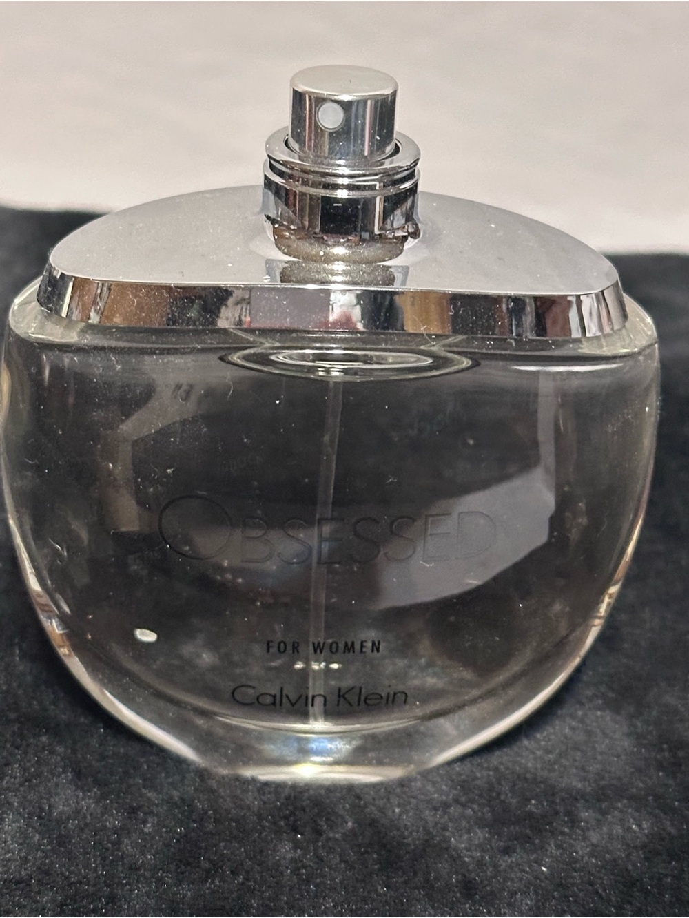 Nina Ricci Clear and Silver Rounded Perfume Bottle